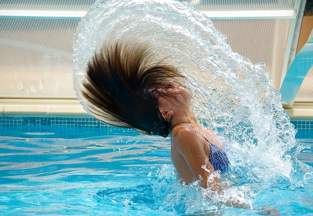 Swimmer splashing in pool
